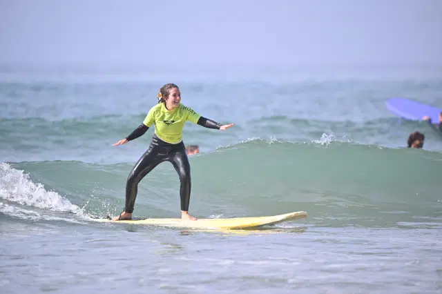 Student riding a green wave